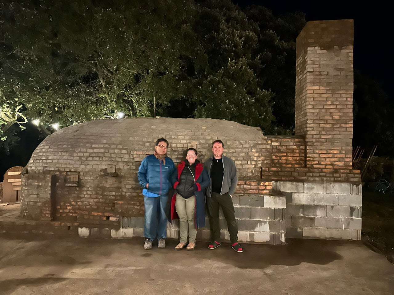 Taiga Mori, Magali Kivatinetz, and Frank Richter standing in front of Kujiragama.