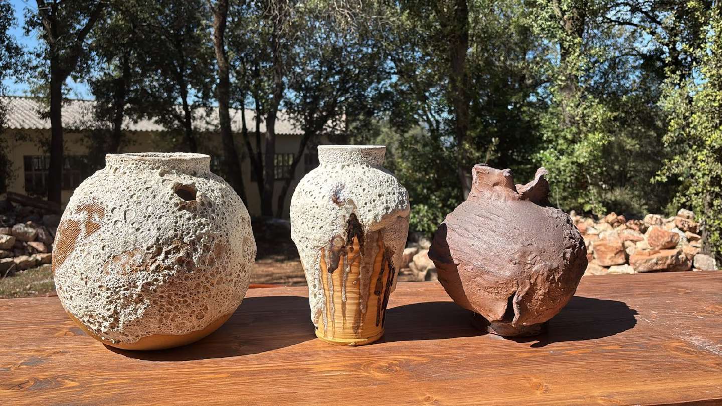 Three wood-fired vases with ash crusts, made for a restaurant dining room.